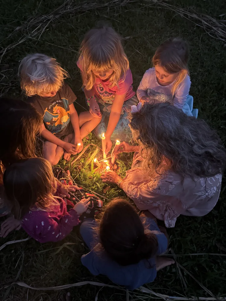 Keiki gathered around a small fire at night